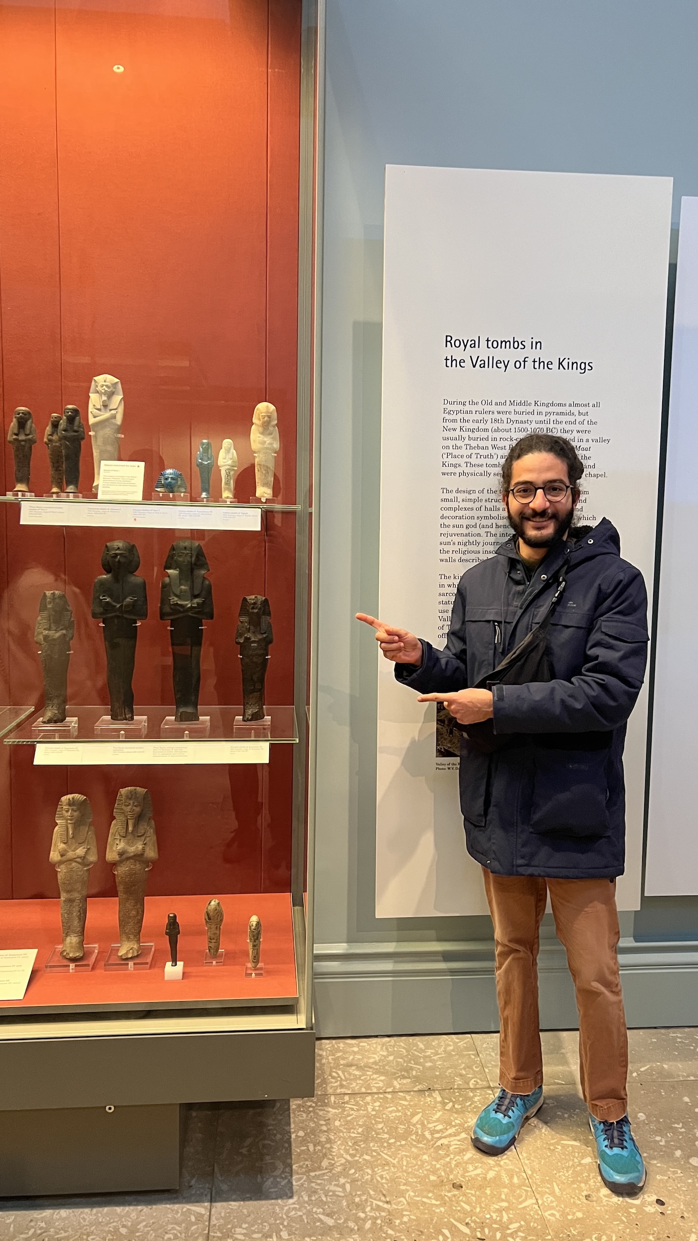 Me in the British Museum in London next to Egyptian Artifacts, March 2024