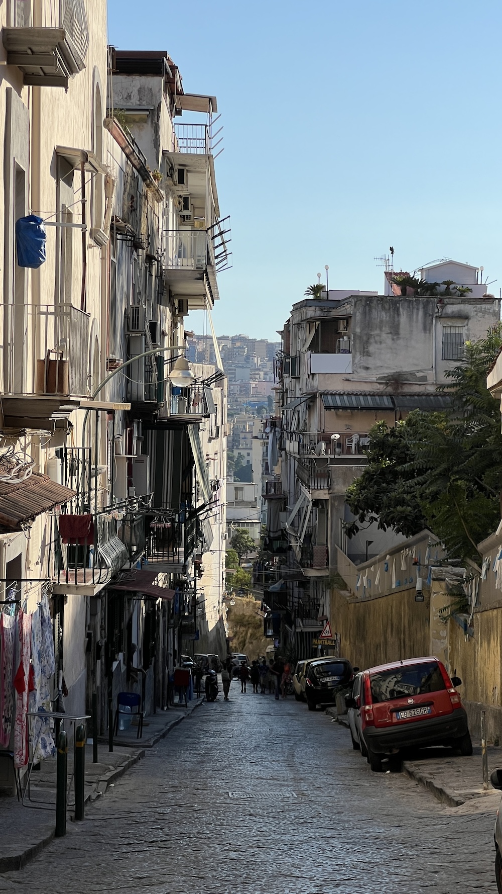 Street looking at a hill in Naples, August 2024